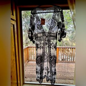 Swimsuit cover up size XS in gray with a tie front. New with tag, never worn.